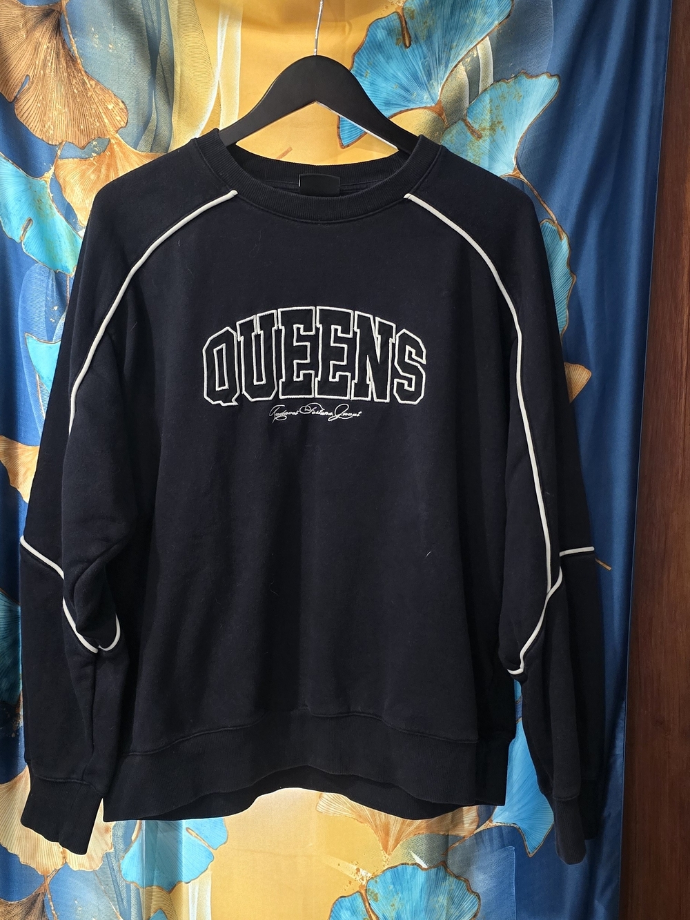 H&M Black Crewneck Sweatshirt with White Piping and QUEENS Script